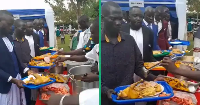 Whole chicken is served to Ugandan men at a wedding.